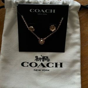 Coach, rose gold, brand new necklace and earring set. Still wrapped with tag.